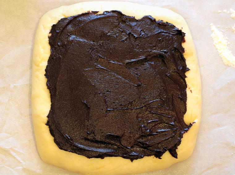 The plain dough with chocolate filling spared overtop.