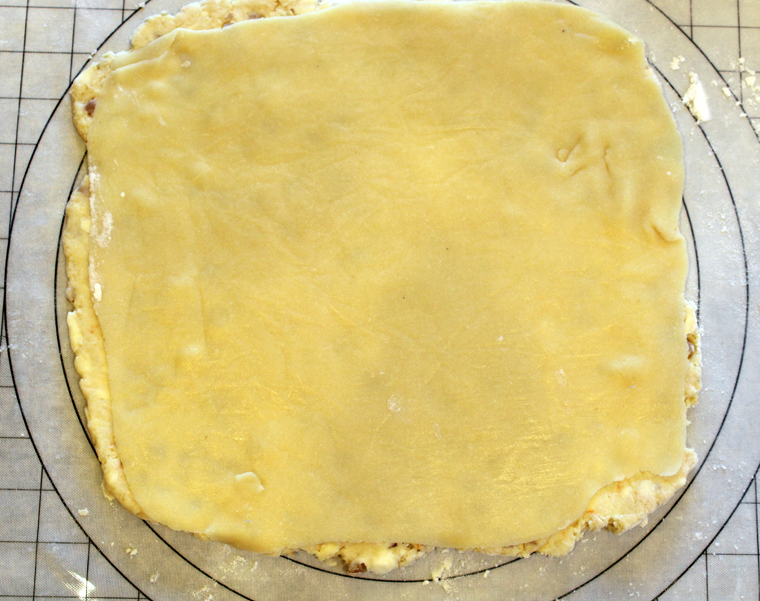 A thin layer of almond paste goes over the dough.