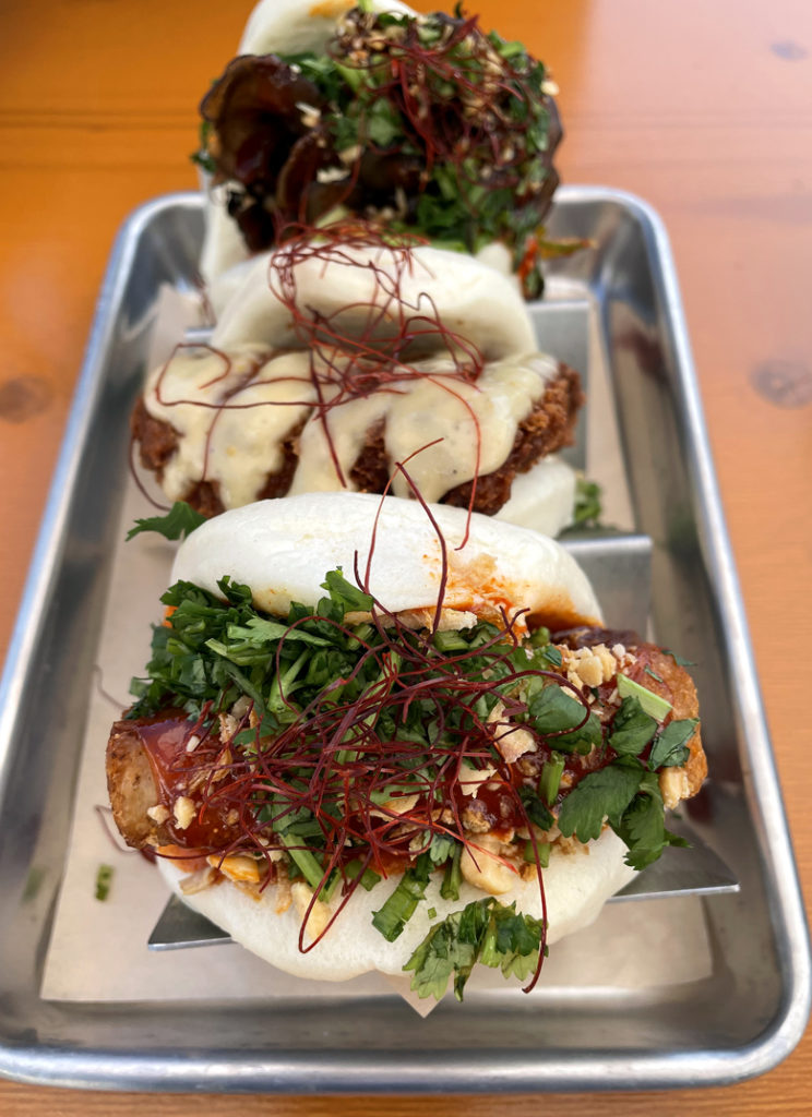 A trio of baos from Bao Bei. (Front to back: pork belly, fried chicken, and smoked mushroom.)
