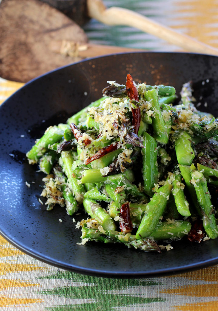 A simple saute of asparagus that gets dressed up with Indian flavors.
