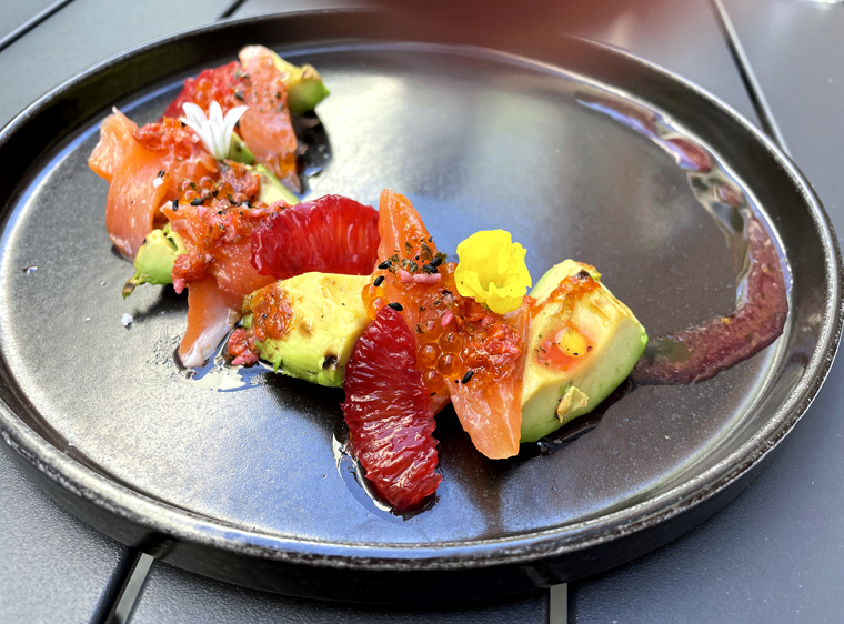 Charred avocado with trout and citrus.