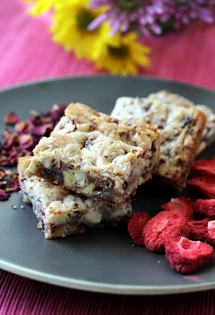 White chocolate, freeze-dried strawberries, and dried rose petals spiff up these blondie-like bars.