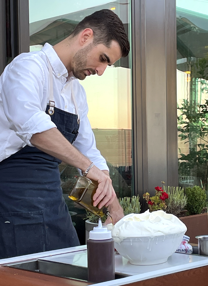 The gelato cart in action with a server pouring on olive oil for a winning touch.