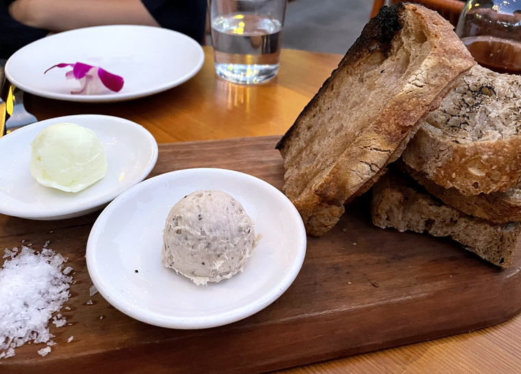 Grilled bread with lardo (front) and buffalo milk butter (back).