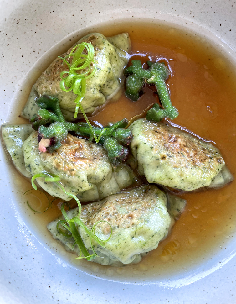 Impeccable duck and crystallized ginger dumplings in bone broth dashi.