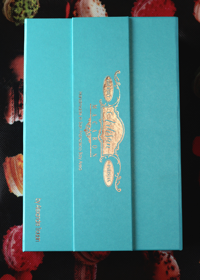 The box that holds a dozen assorted macarons.