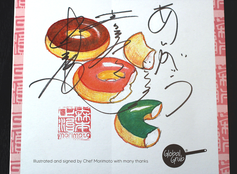 The cover of the instruction booklet is signed by Morimoto.