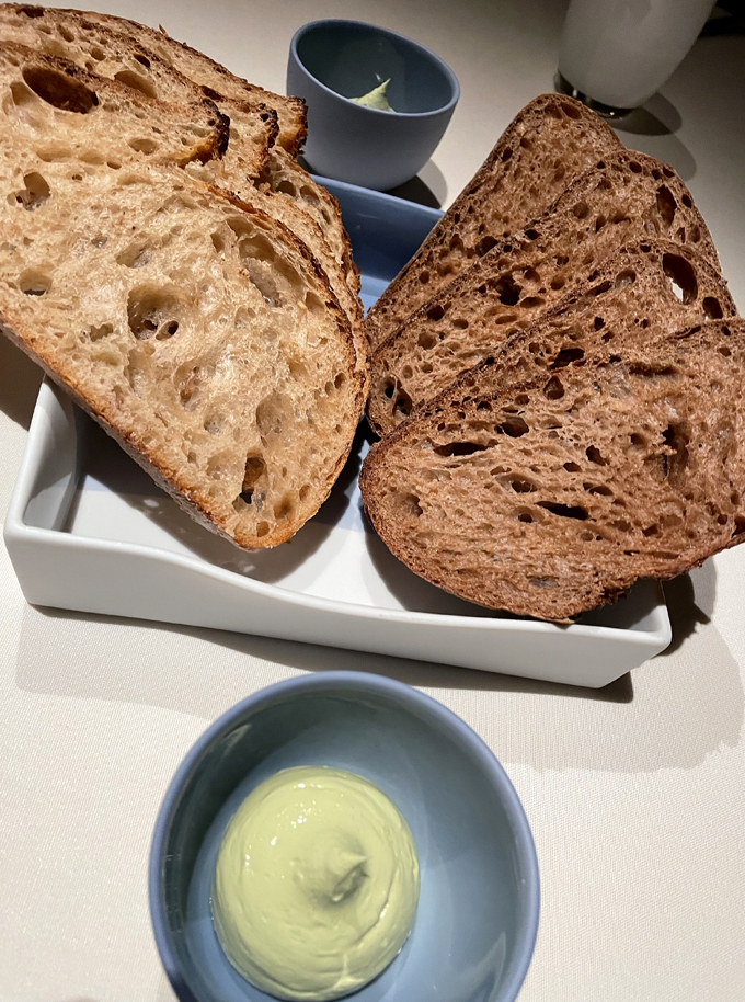 Manresa Bread selections with herb butter.