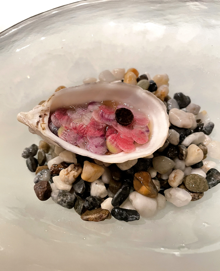 Oyster with dashi and fermented truffle.