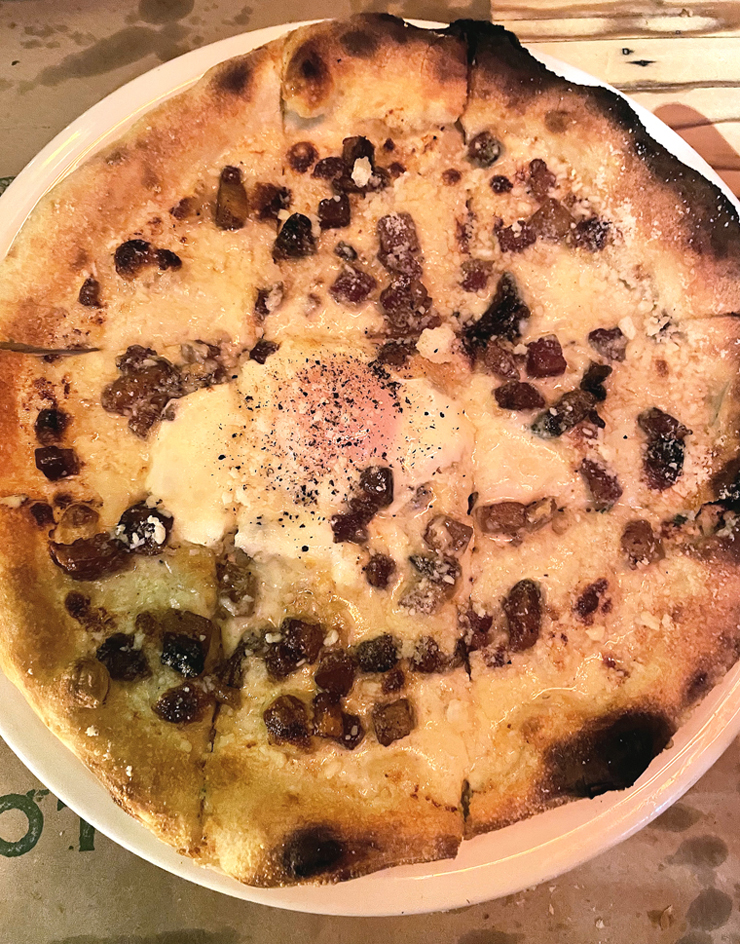 The "Carbonara'' pizza with an egg at its center.