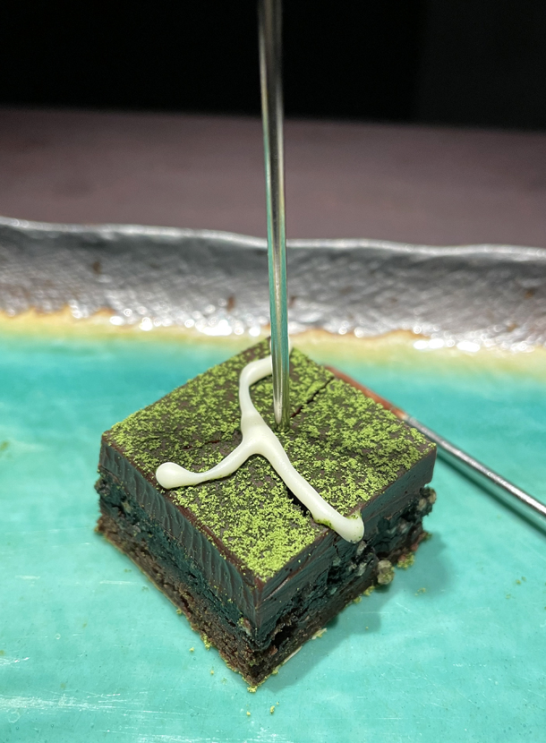 A square of sesame-matcha dark chocolate to enjoy before you leave the chocolate room.