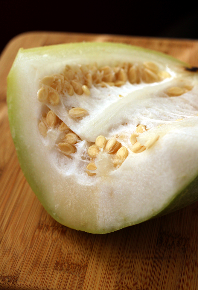 Winter melon can grow crazy big, but are usually sold in already cut wedges like this.
