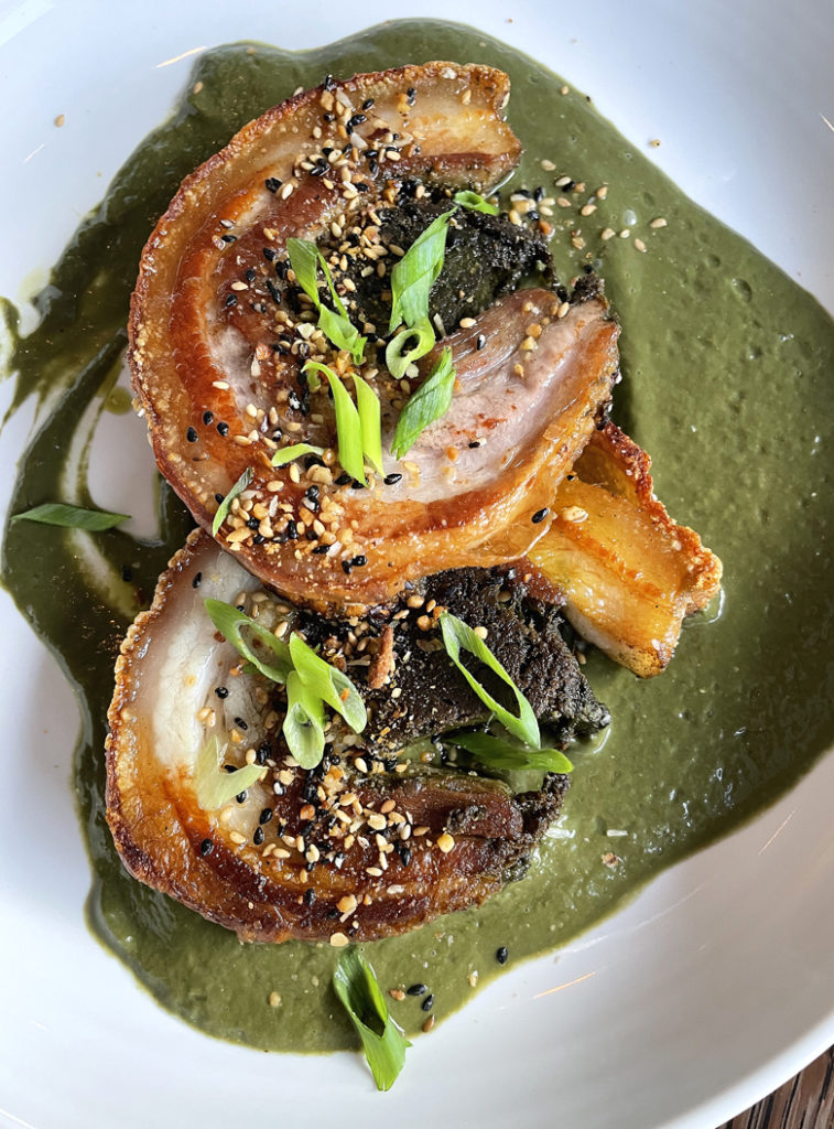 A magnificent porchetta made with local pork and stuffed with a filling of taro leaves.