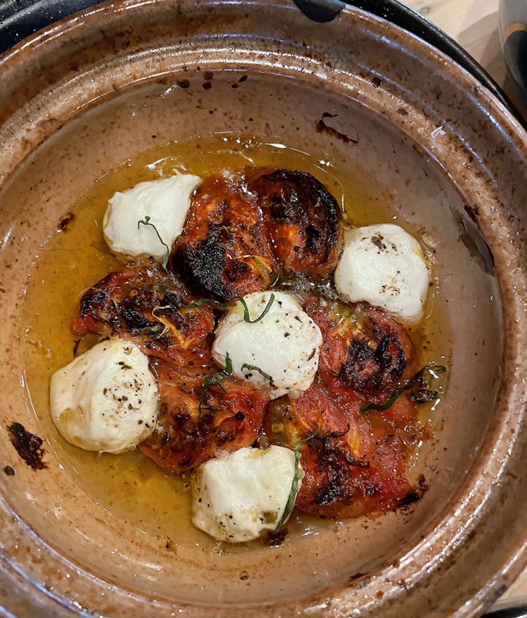 A hot sun-dried tomato dish with labneh.
