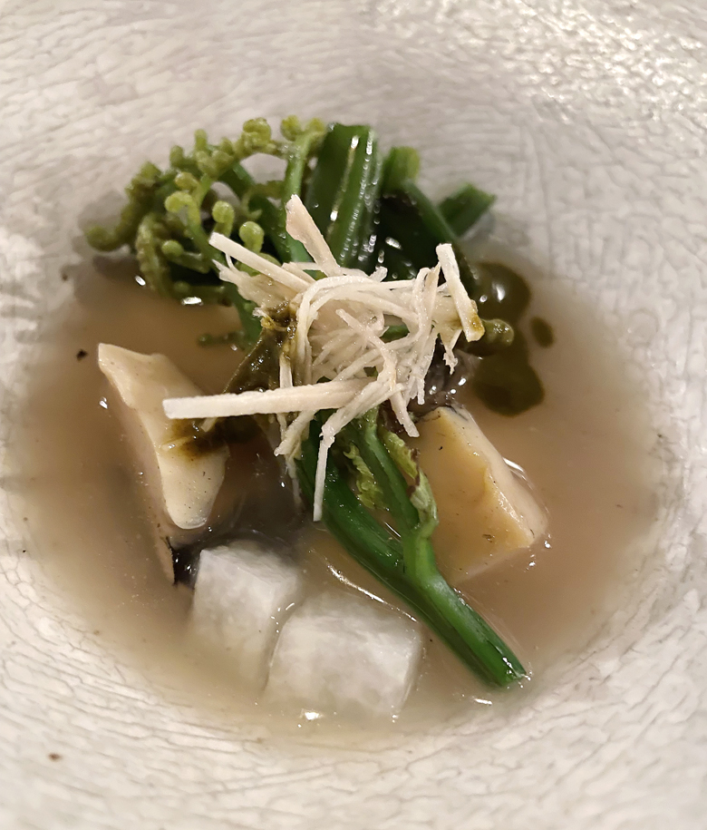 Kona abalone with ginger shards and fiddlehead ferns.