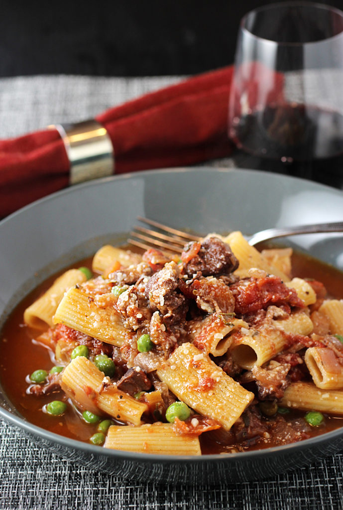 Luscious red wine-simmered lamb and sweet peas combine for this easy rigatoni dish.