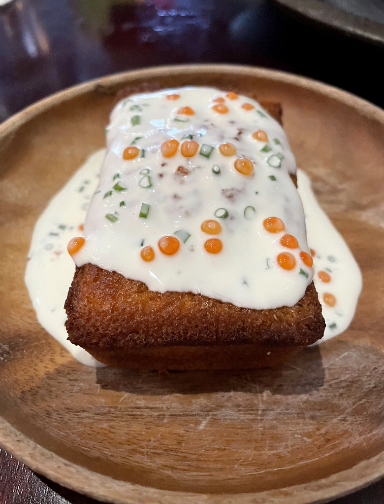 Reel in the warm cornbread with cultured cream and smoked trout roe at One Fish.