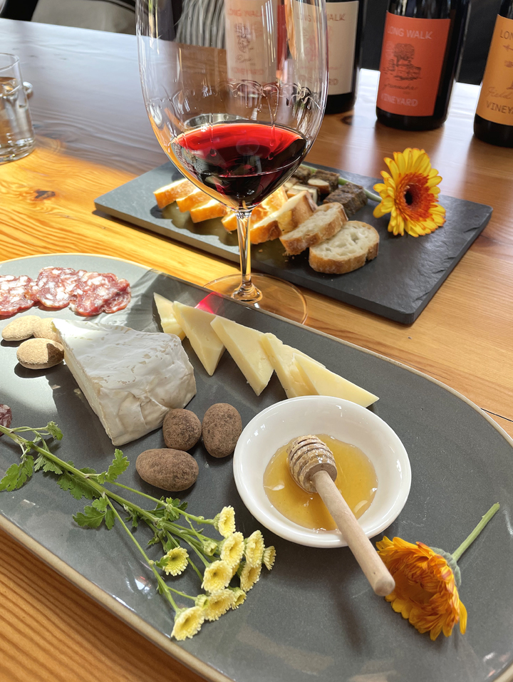 The 2021 Carignane with charcuterie board that includes the winery's own honey.