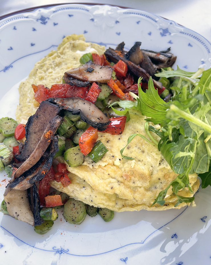 Cheese omelet with sauteed mushrooms.