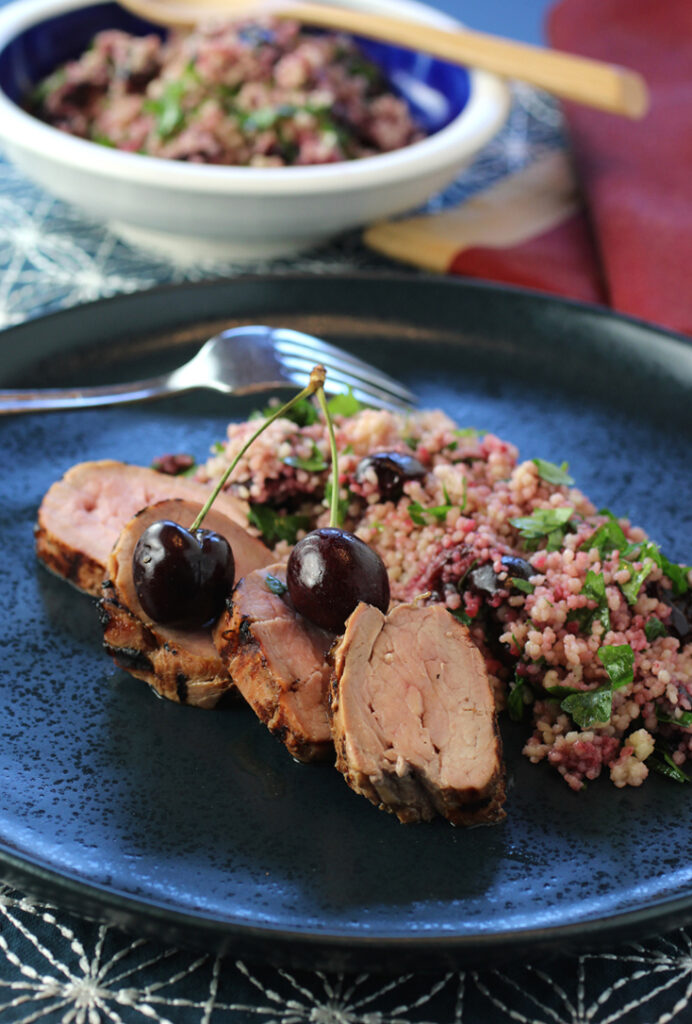 You won't believe how easy and fast it is to make this grilled pork tenderloin with cherry couscous salad.