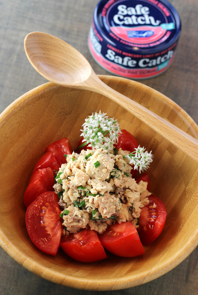Safe Catch Wild Pink Salmon with summer tomatoes and chive blossoms.