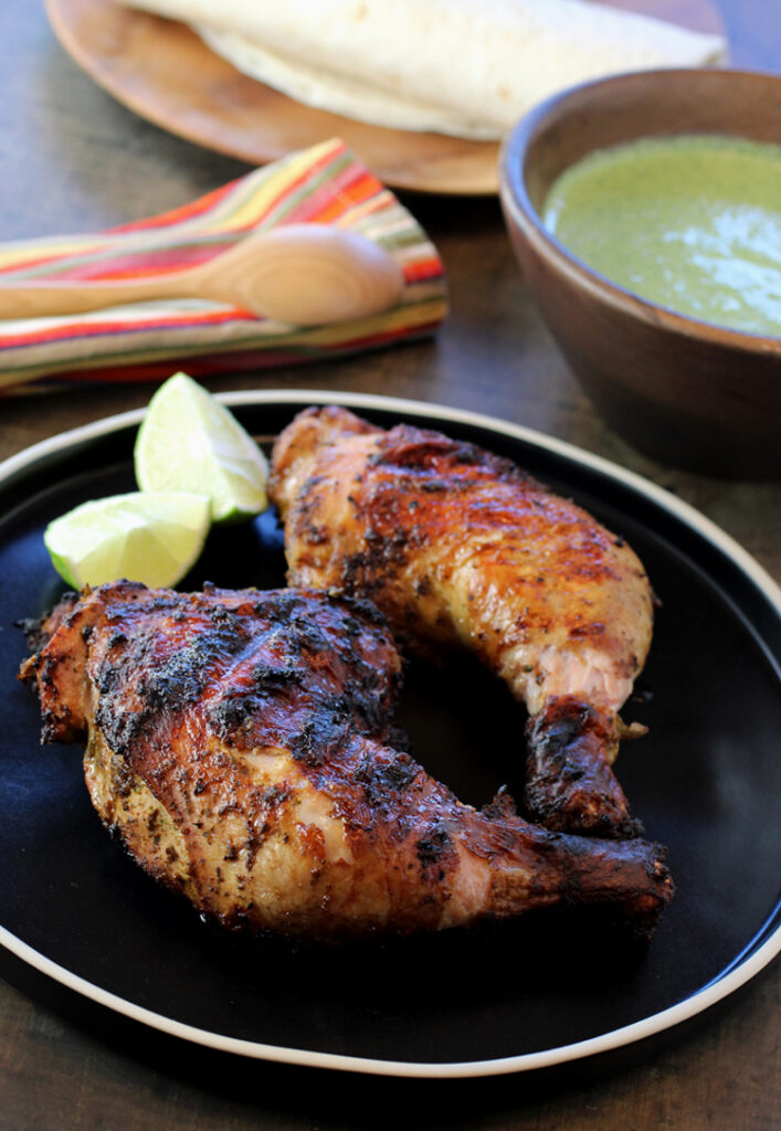 Grilled chicken in a flavorful marinade gets served with addictive aji sauce.
