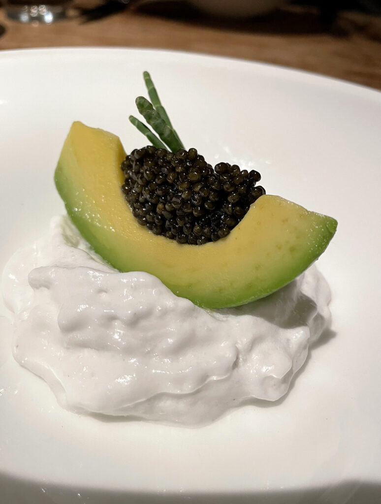 Avocado stuffed with caviar and atop a cloud of coconut at 1601 Bar & Kitchen.