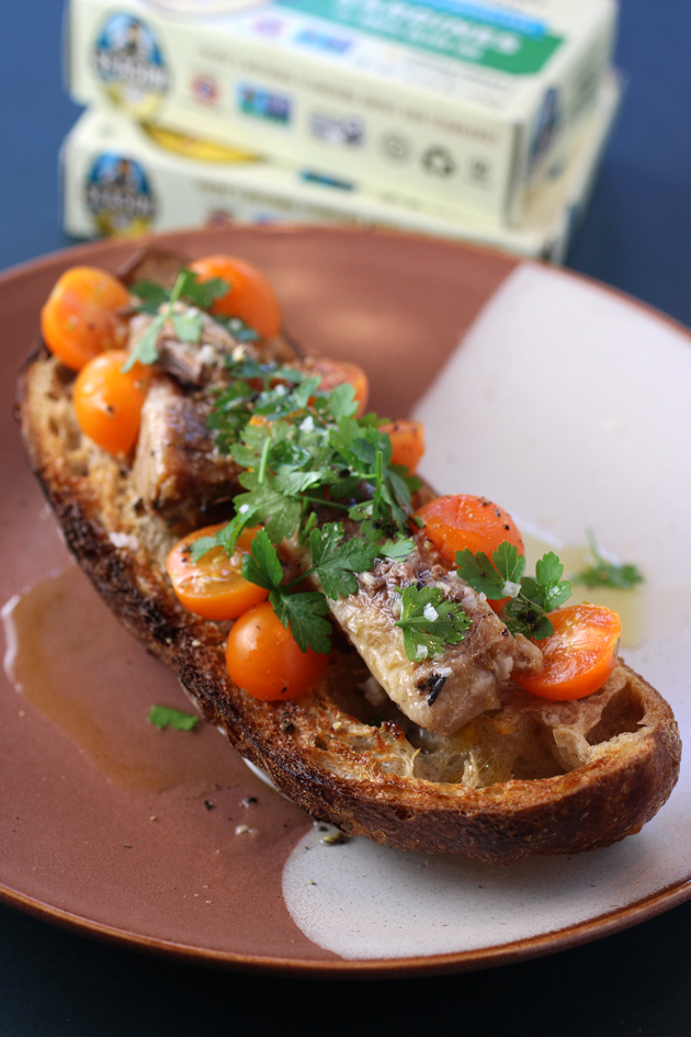 Wild-caught sardines in olive oil are perfect for topping crostini with tomatoes and herbs.