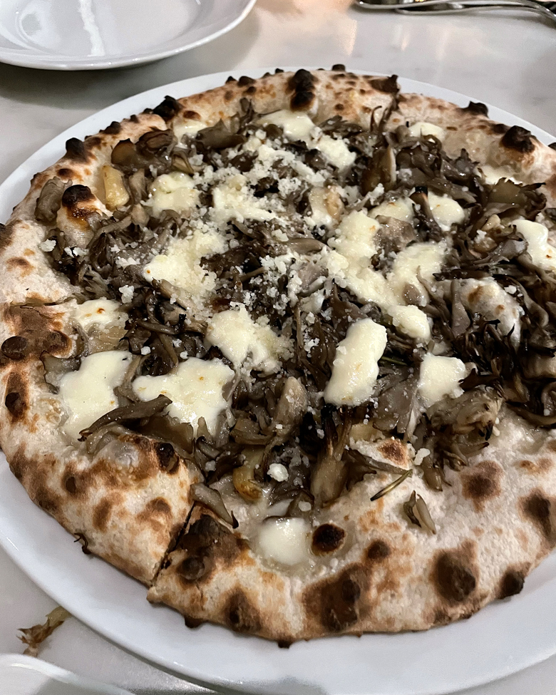 Hen of the woods mushrooms cover this satisfying pizza at La Connessa.