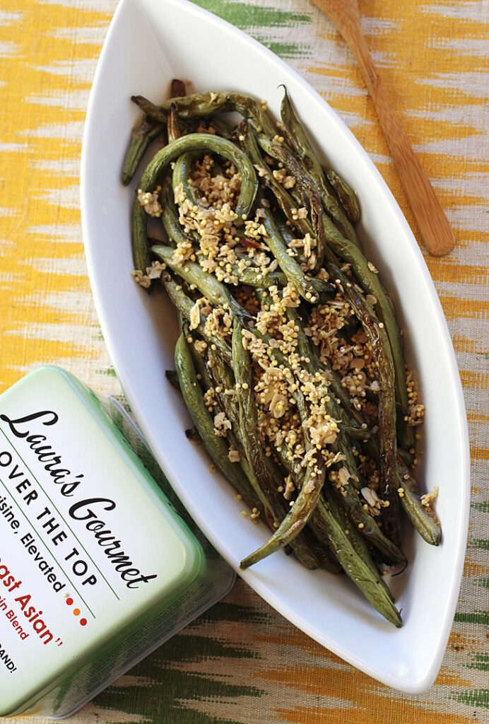 Roasted green beans get a sprinkle of Laura's Gourmet Southeast Asian Savory Topper.