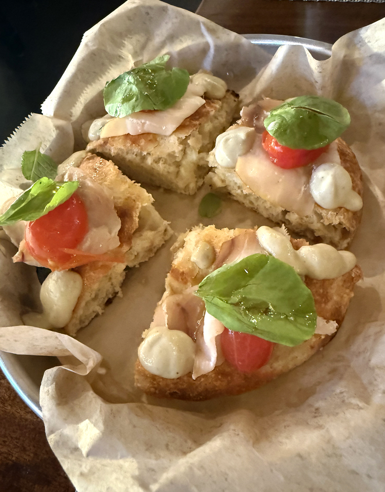 Several types of pizza are offered on Donato Enoteca's new menu, including this pan pizza topped with house-smoked swordfish.