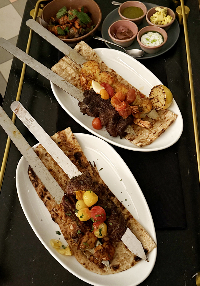 A trolley of skewers.