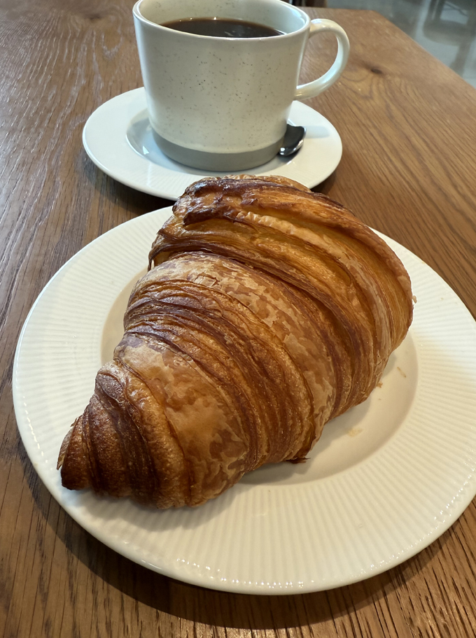 Croissant and coffee for breakfast.