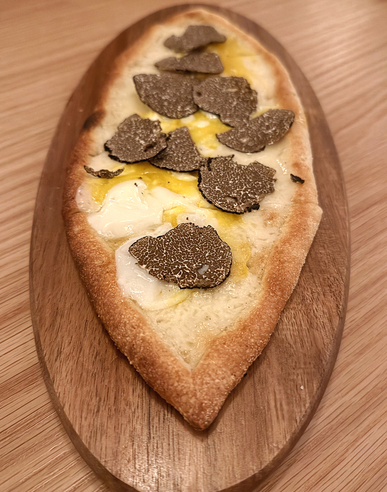 Black truffle-topped pide.