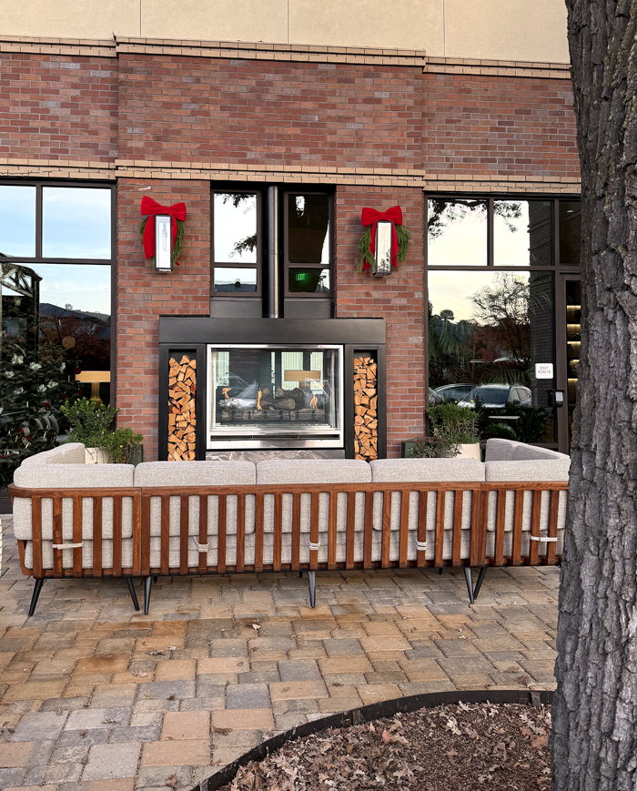 A two-sided fireplace warms things up inside and outside.