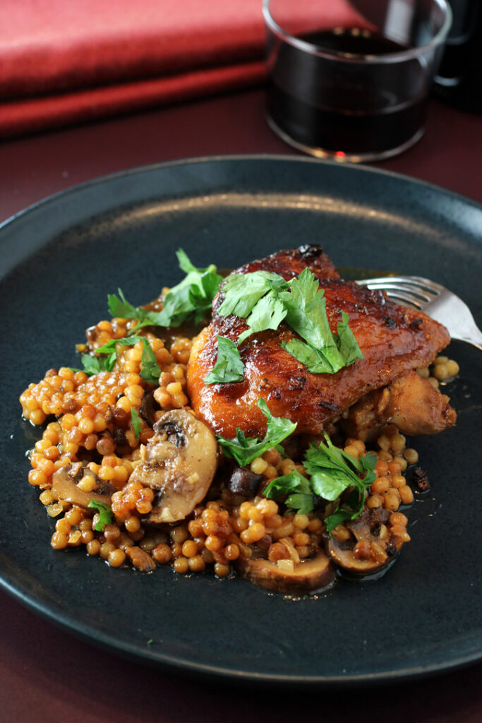 Honey garlic chicken, mushrooms, and fregola in a fabulous one-pot dish.
