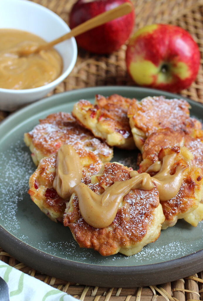 Yeasted pancakes brimming with Pazazz apples that get finished with a velvety peanut butter sauce.