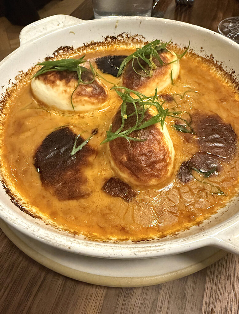 Fluffy rockfish dumplings in a concentrated lobster bisque at Lagniappe.