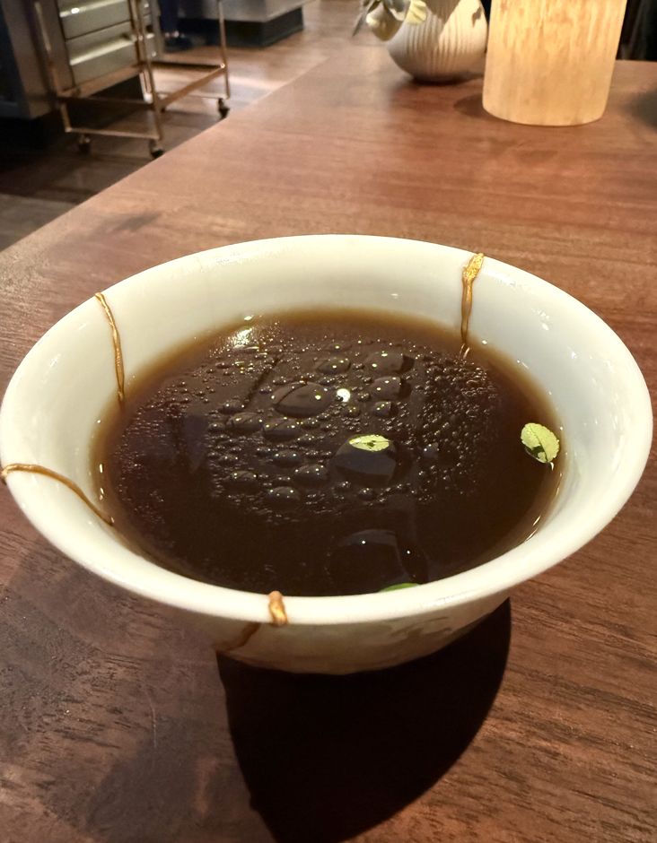 Warm broth made from the crab shells.