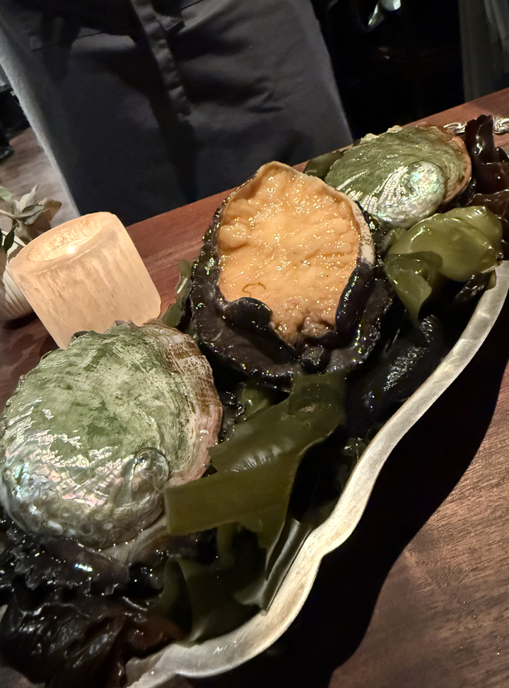 Abalone presented at the table.