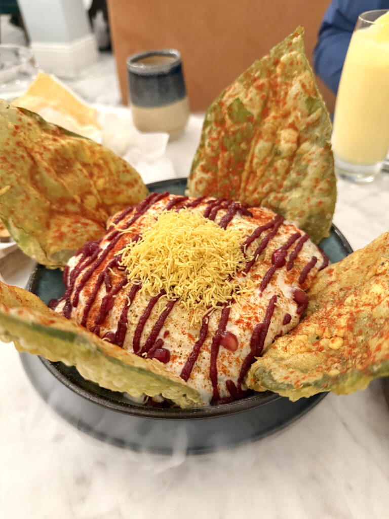 The very showy betel leaf chaat that arrives at the table in a cloud of dry ice.