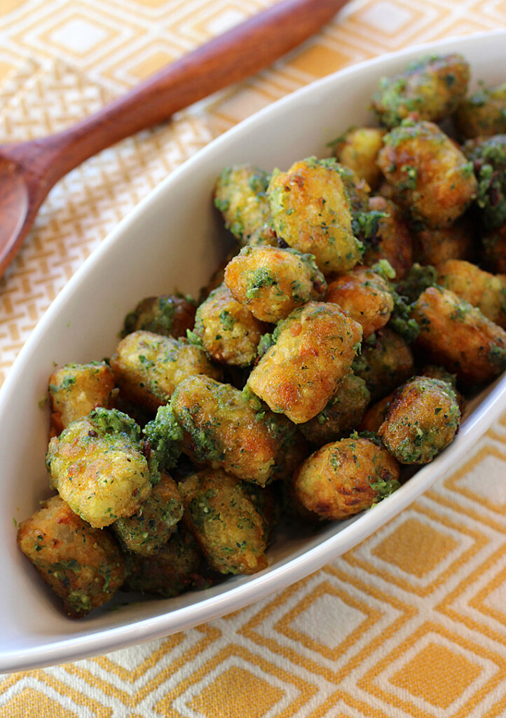 Tater tots get dressed up with an easy garlic-Parmesan-date butter.