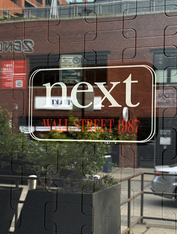 The sign marks the spot, but you can't see into the restaurant from the street.