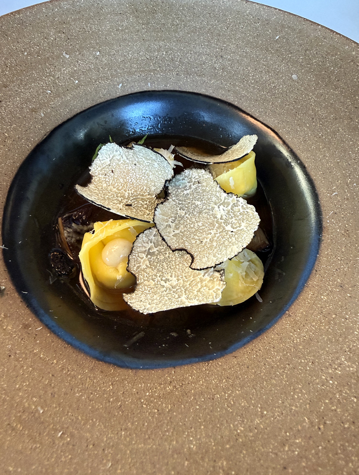 Tortellini with supplemental black truffle slices.