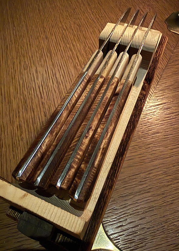 Presenting the steak knives.