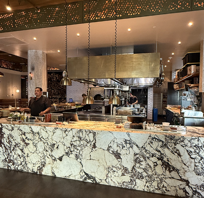 The open kitchen that greets you as you enter the restaurant.