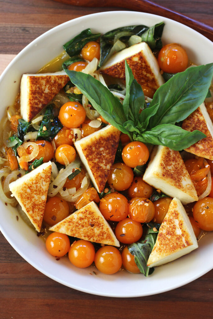 Sweet Sungold cherry tomatoes get an Indian-inspired treatment in this summery dish.