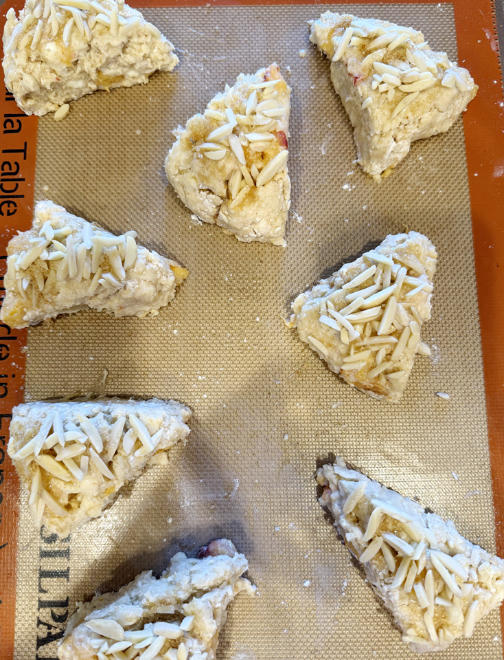 Top with slivered almonds and sugar before baking.