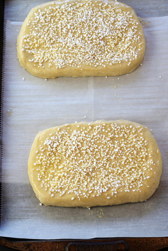 The dough is formed into oval loaves, then sprinkled with pearl sugar.